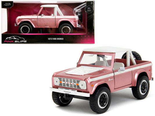 1973 Ford Bronco Pink Metallic with White Top and Graphics "Pink Slips" Series 1/24 Diecast Model Car by Jada