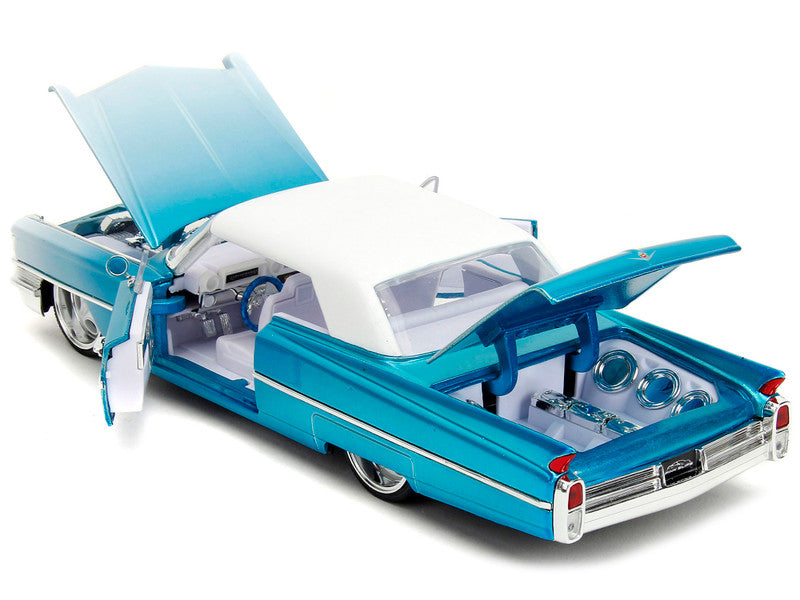 1963 Cadillac Coupe DeVille Blue Metallic and White Gradient with White Top and Interior "Pink Slips" Series 1/24 Diecast Model Car by Jada