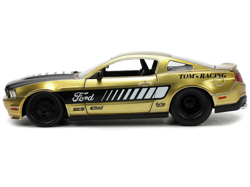 2010 Ford Mustang GT Gold Metallic with Black Graphics and Hood "Tom's Racing" "Bigtime Muscle" Series 1/24 Diecast Model Car by Jada